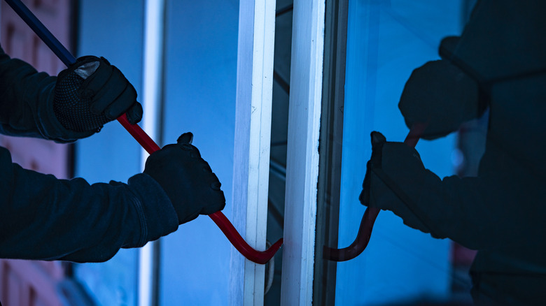 breaking into a home with a crowbar