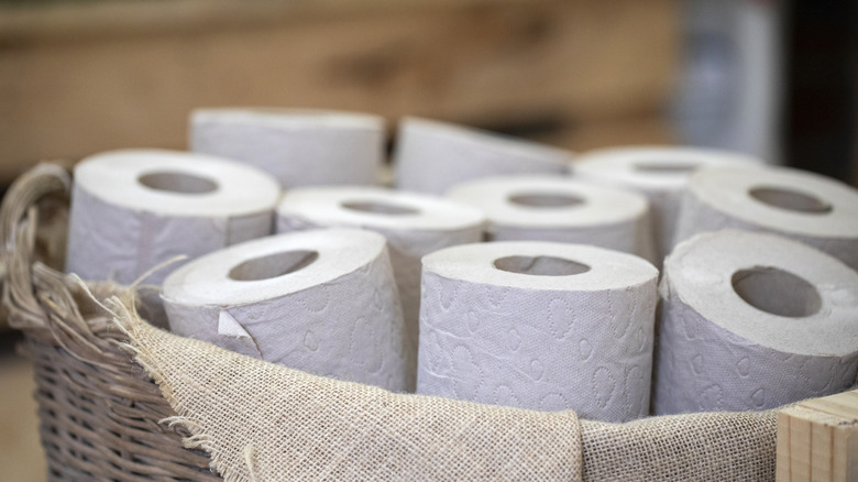 toilet paper rolls in a basket