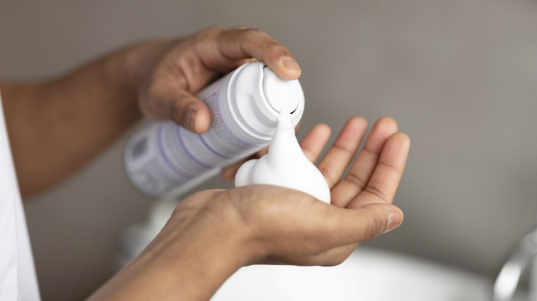 squirting shaving cream into hand