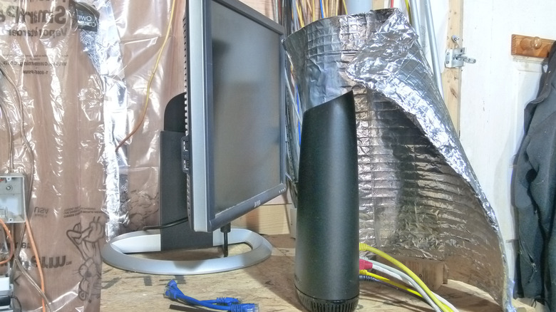 Setting up the Wi-Fi reflector atop my mechanical closet network rack