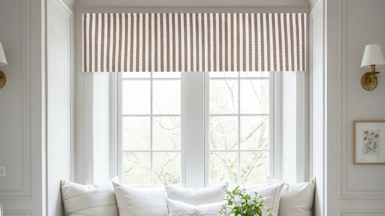 Striped valance over bay window reading nook