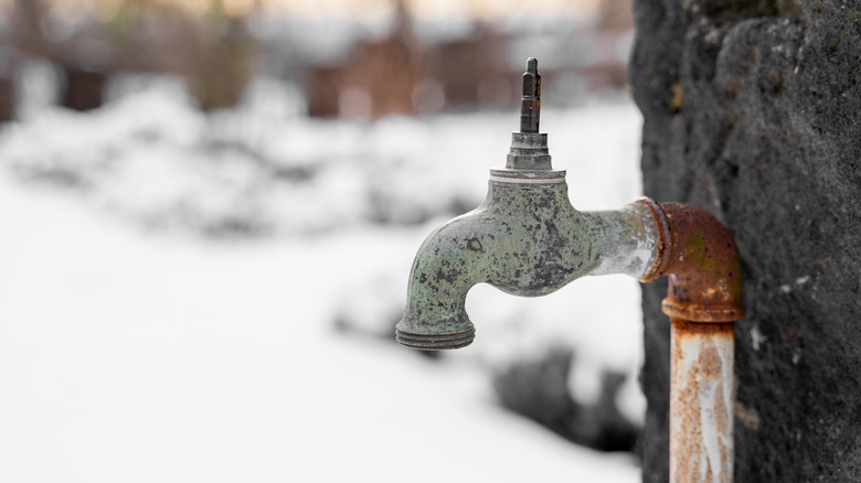 Retro outdoor faucet in winter