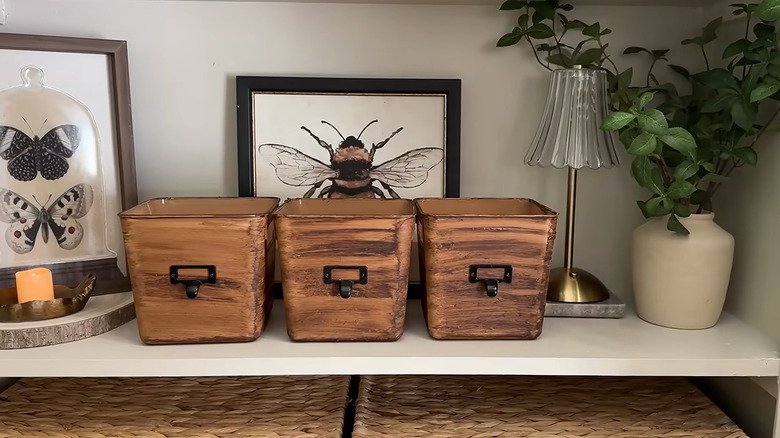 bins painted to look like wood with metal label holders glued to the side