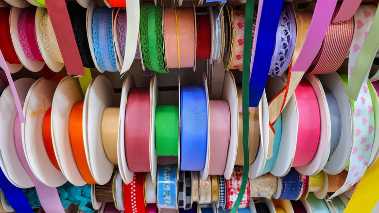 Dozens of spools of ribbon at store