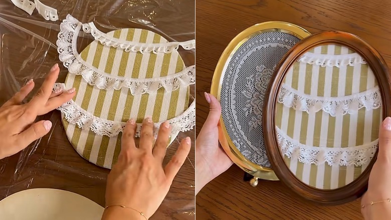 A person pressing lace onto an oval picture frame to add rows to hang earrings.