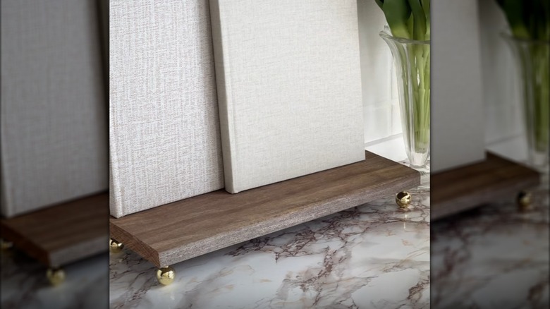 DIY countertop tray made by attaching IKEA door pulls on the bottom of scrap wood