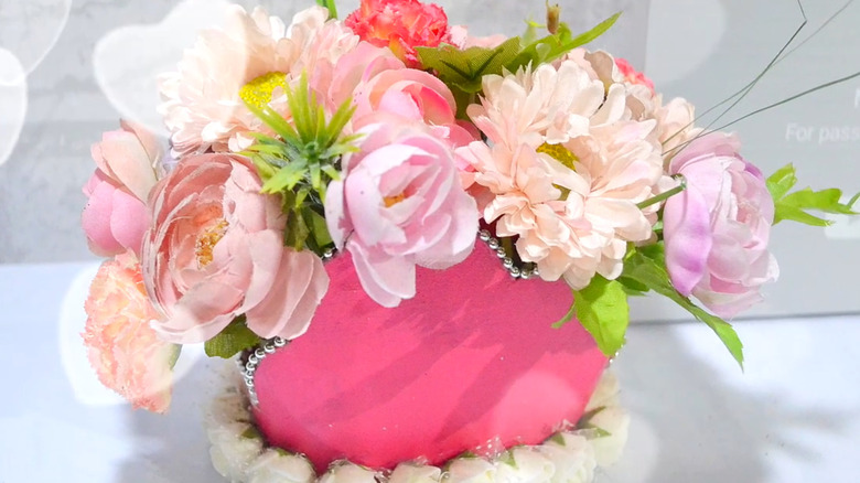 finished floral centerpiece made from a detergent bottle