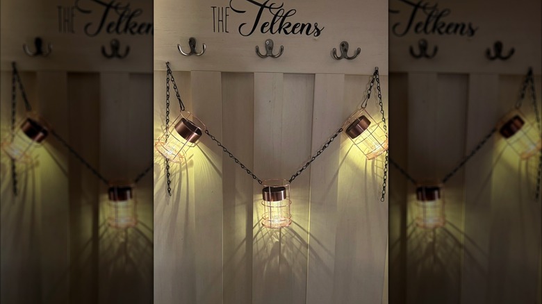 YouTuber CraftyBeach's string cage lights made of Dollar Tree pencil cups and solar path lights