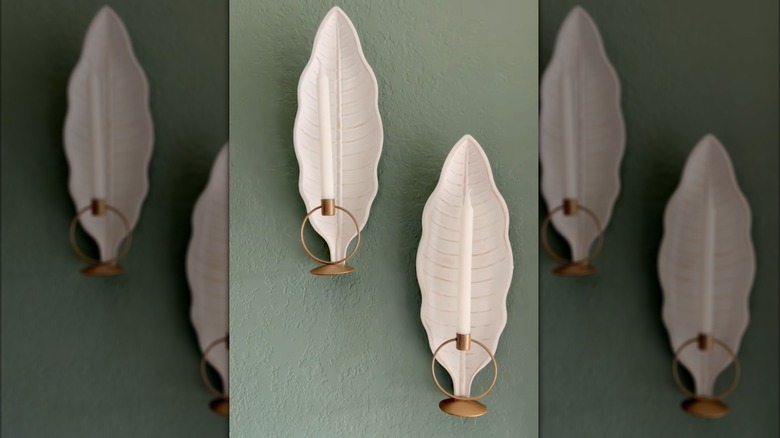 DIY white leaf wall sconces on a green wall