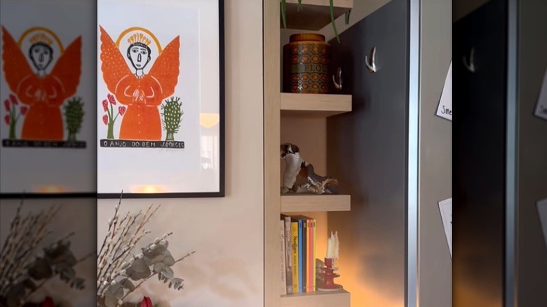 IKEA LACK vertical wall shelving unit creating storage in the narrow space next to the fridge