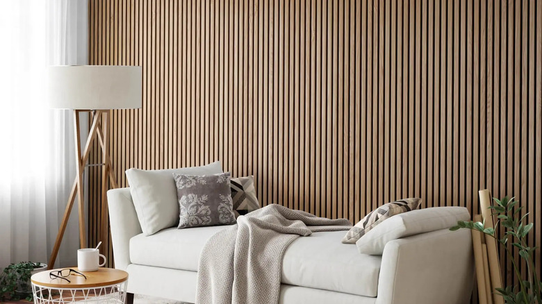 hexagon wood paneling with neutral couch and blue blanket