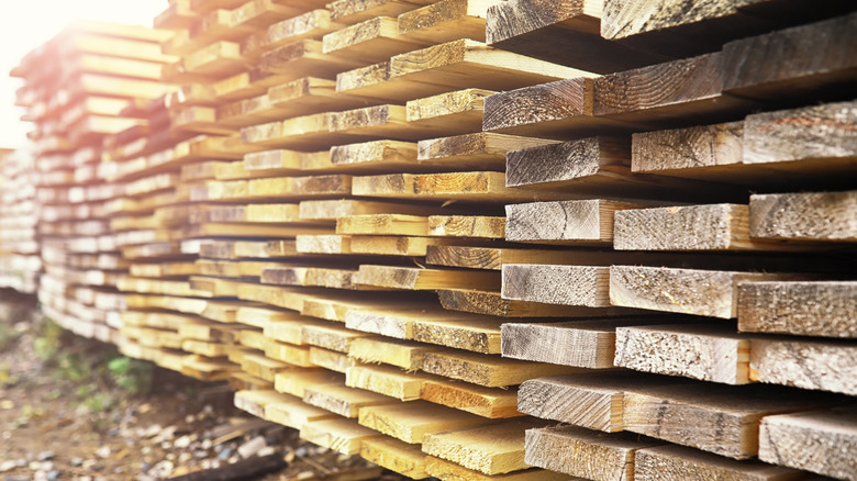 Lumber stacked outside ready for use