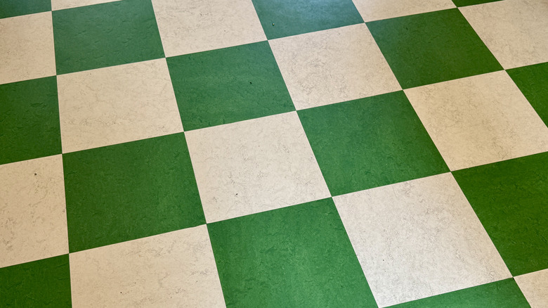A checkered green and white linoleum floor
