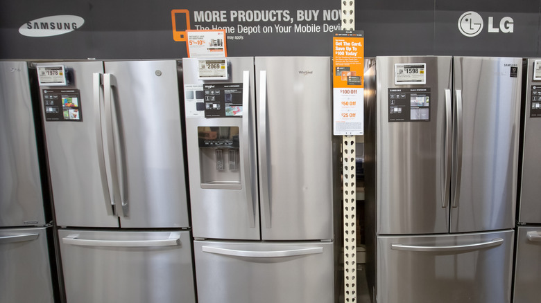 Samsung and LG refrigerators on the sales floor of an appliance store