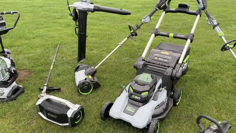 A collection of EGO power tools on grass