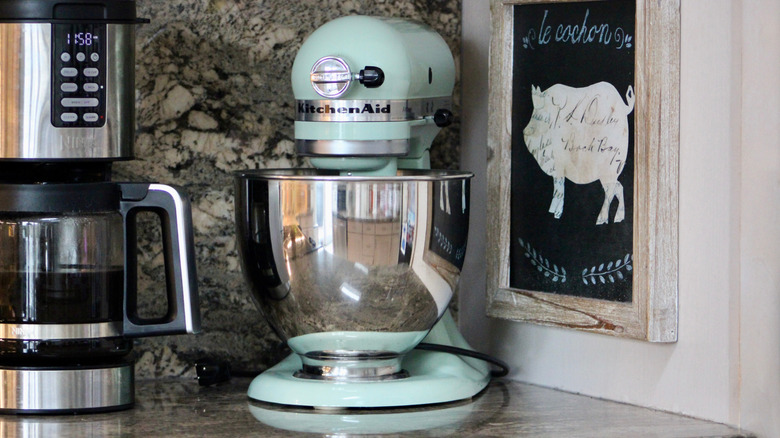 A KitchenAid stand mixer sitting on a kitchen counter.