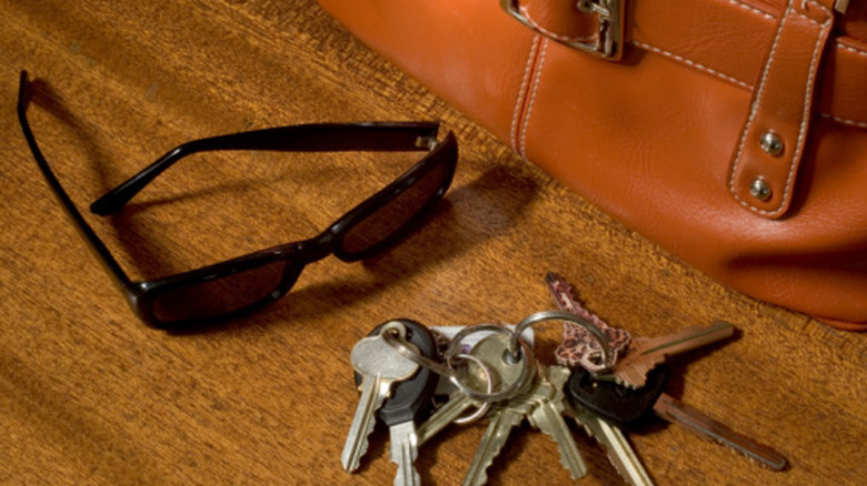 Sunglasses, purse, and keys on countertop
