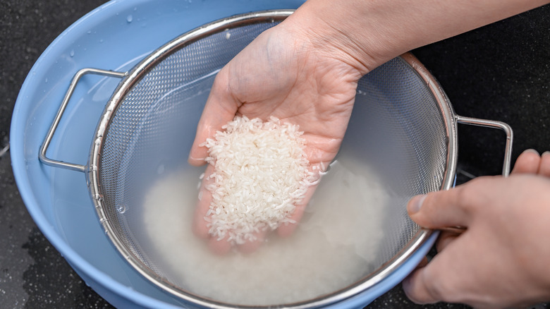 Straining rice for rice water